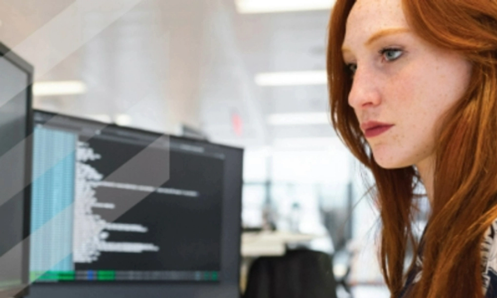 A student working off two computer screens