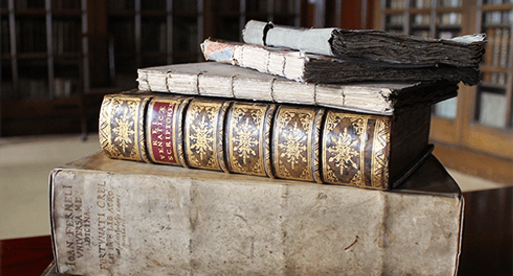 stack of old bound books
