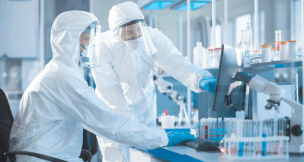 Two lab technicians doing experiments