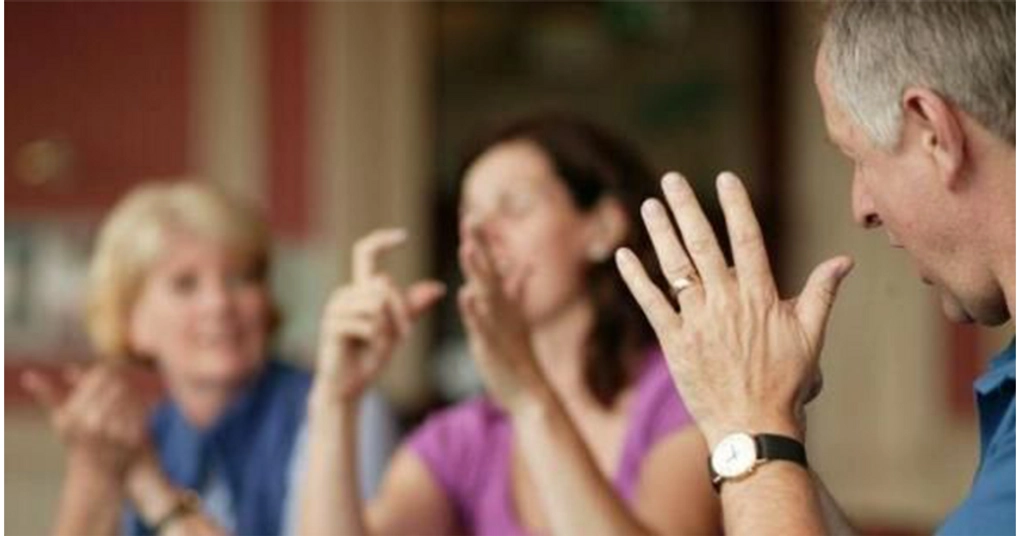 People doing sign language