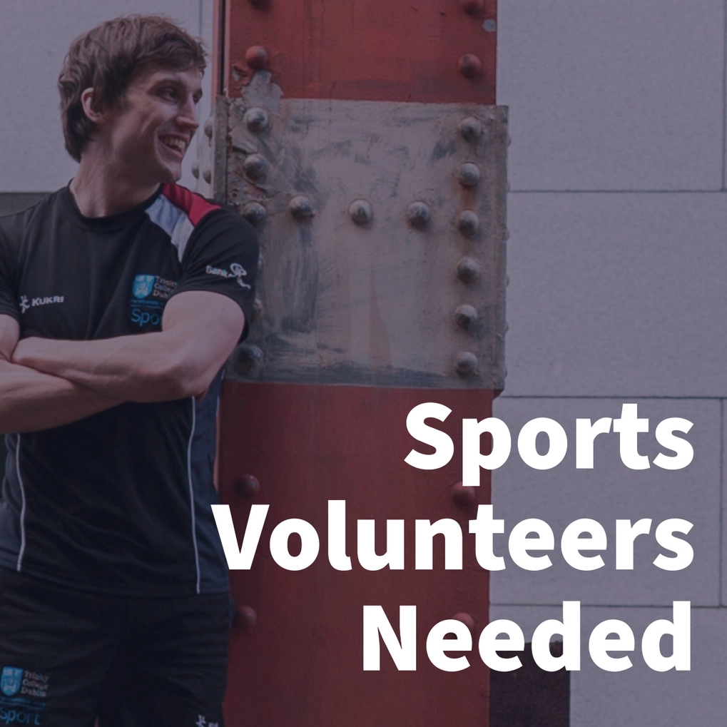 A sports volunteers smiling