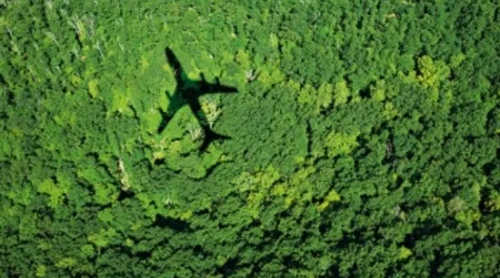 The shadow of a plane over land