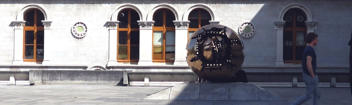 Pomodoro sculpture with passing student