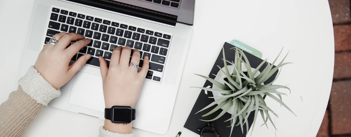 Typing on a laptop