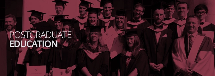 A group photo of engineering graduates with a red tint overlay on the picture