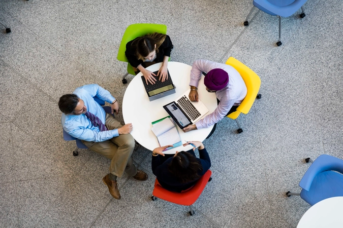 aerial shot of students sitting at a table