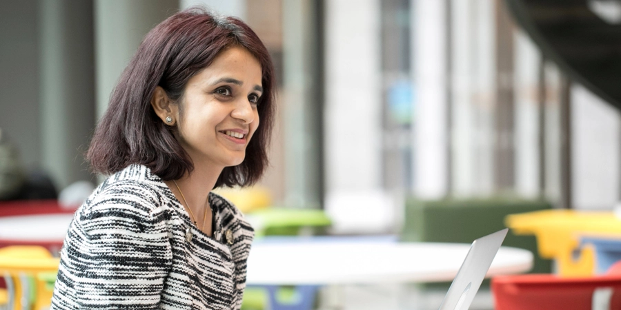 Student sitting at desk with a laptop
