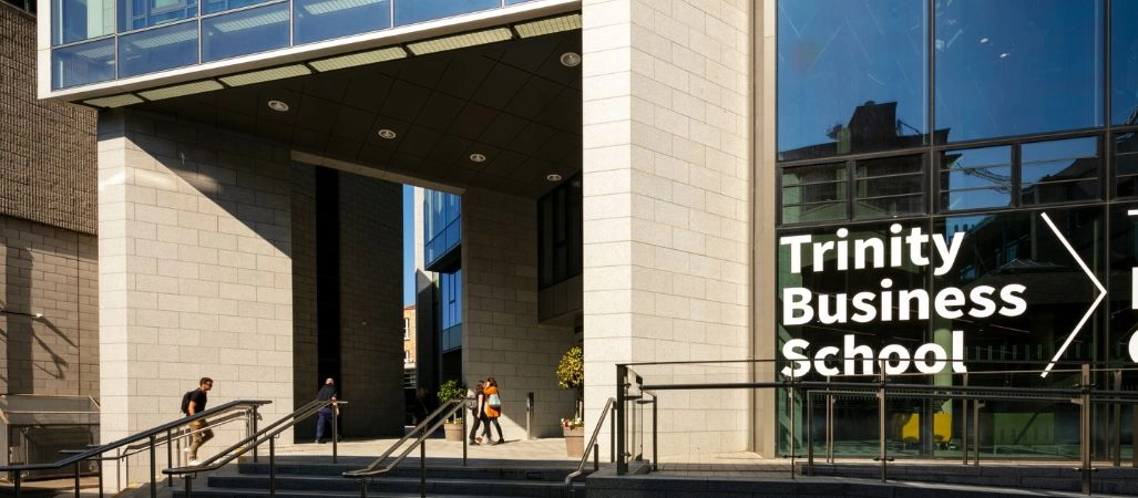 Exterior of TBS with students walking into the building