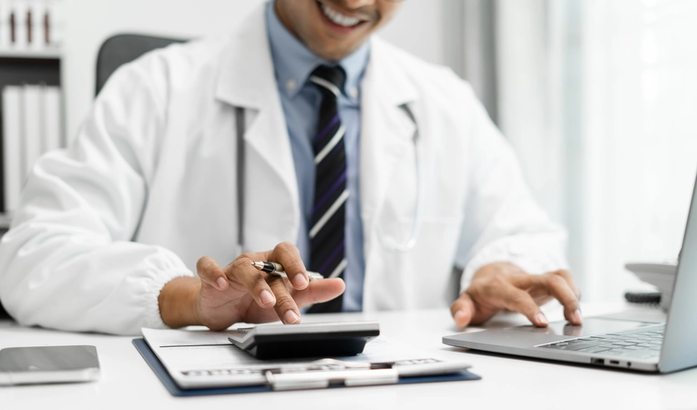 A healthcare professional calculating budget and finance