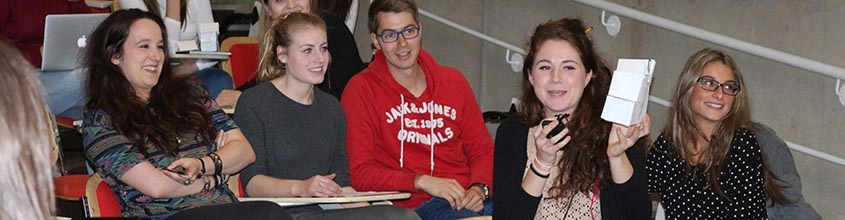 A group of students sitting in a lecture theatre