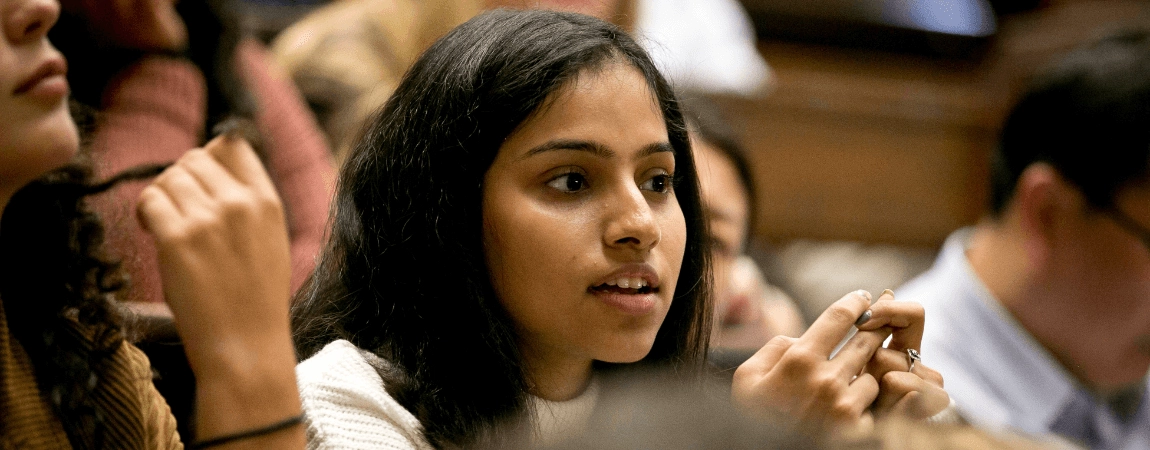 student in a busy lecture hall