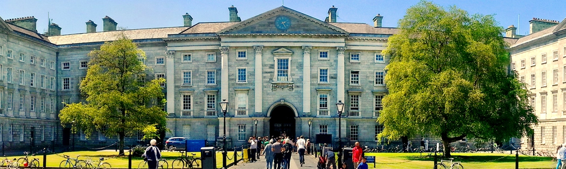 Trinity Front Square facing toward front entrance on a summer day with people walking in and out
