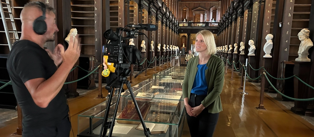 John Cassidy IT filming with Laura Shanahan in the Old Library