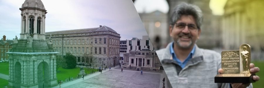 Prof. Anil Kokaram holding a Oscar award for motion picture engineering.