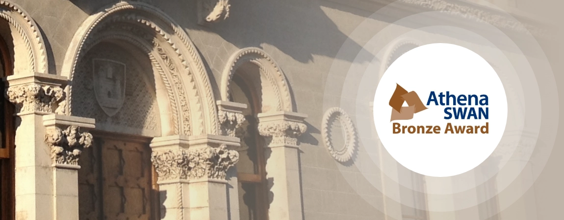 An image of the front door of the Museum building with the Athena Swan logo superimposed on it