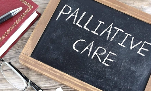 Small blackboard with words paliative care in chalk