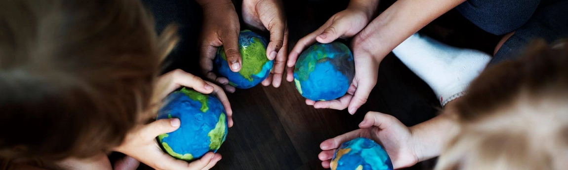 Children holding globes