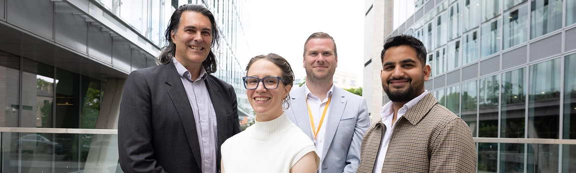 4 members of the Learnovate team standing outside the building