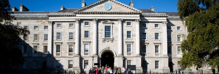 People walking through the Front Square main entrance to Trinity College Dublin