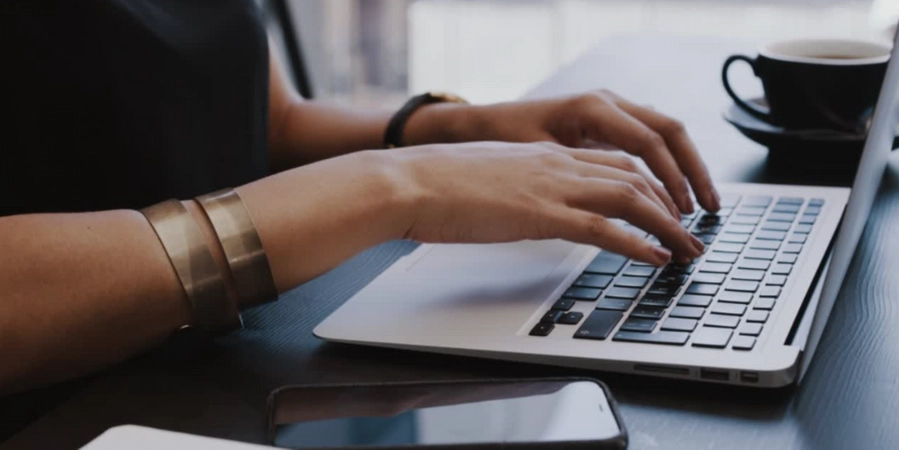 A person typing on a computer