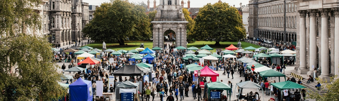 Fresher's Fair stalls and crowds of students in Front Square.