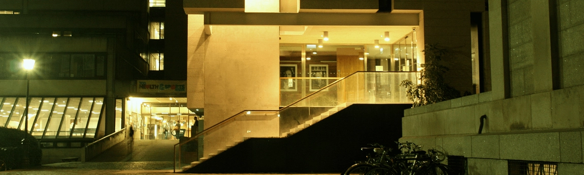 The Arts Building and Long Room Hub, illuminated at night.