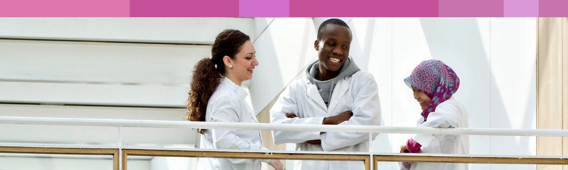Trinity students in conversation in the School of Medicine building.