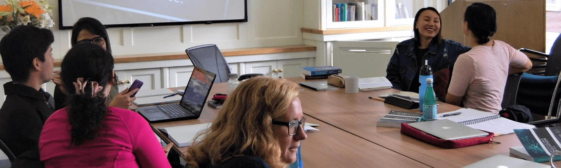 Students seated around a table during a Literary Translation class.