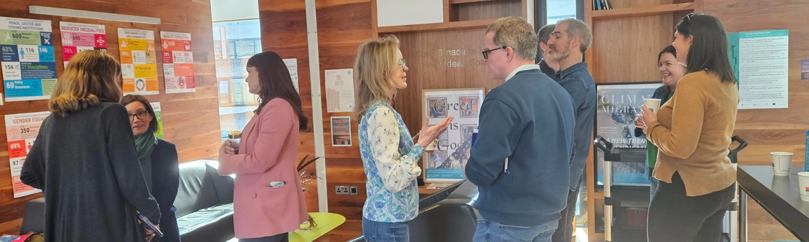 School colleagues in conversation in Trinity Long Room Hub.