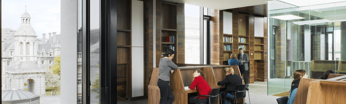 People in conversation in the Long Room Hub.