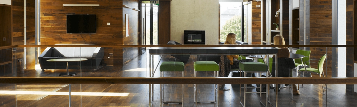 Two people seated in the Long Room Hub Ideas Space.