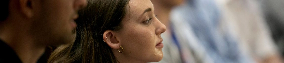 Dual BA students paying attention in a lecture.