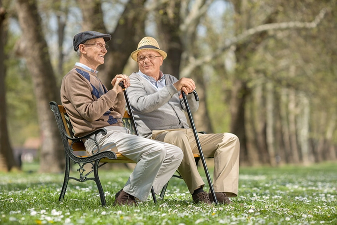 two men sitting on a bench