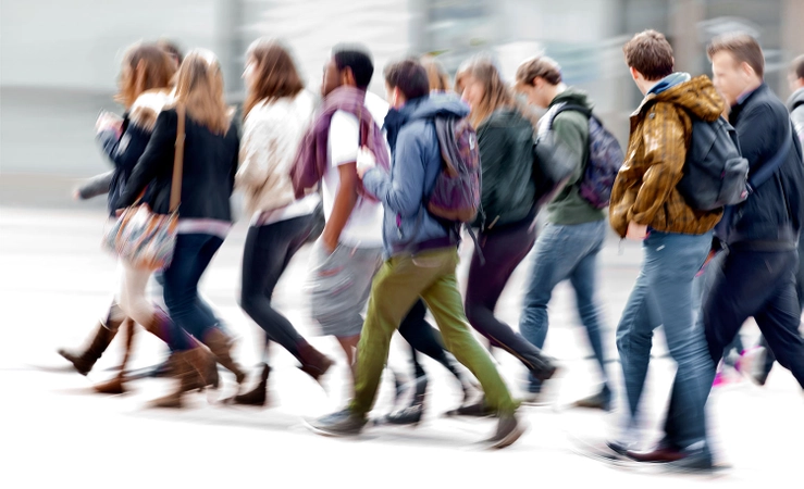 Students walking across the TCD campus