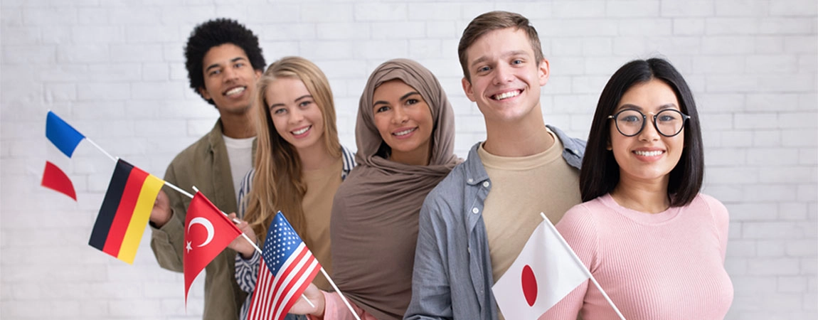 Exchange students and language school for different people. Funny digital young international pupils holding flags of USA, Japan, Turkey, Germany and France in classroom, studio shot, empty space
