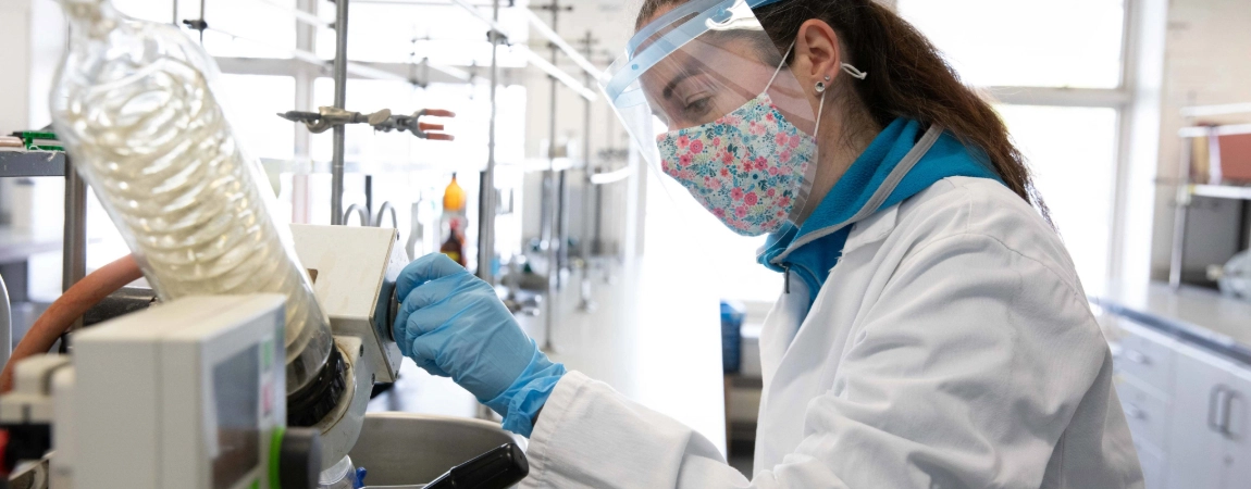 A postgraduate student working in a lab