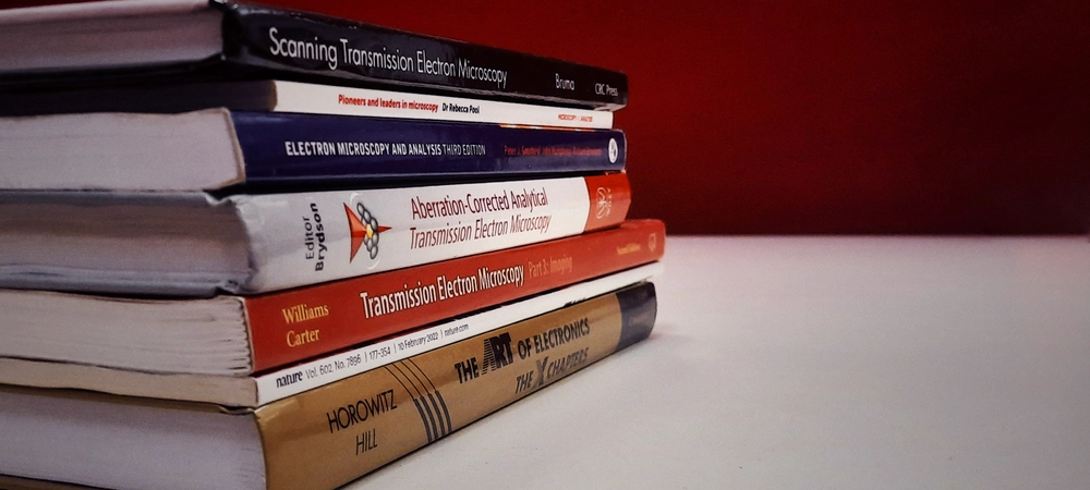 A stack of microscopy books