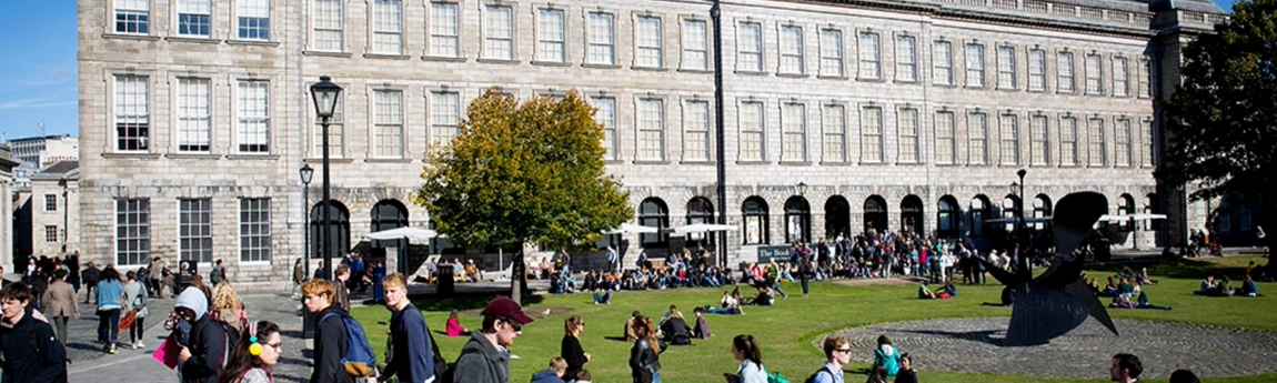 picture of lots of students and visitors outside the Old Library in Trinity College Dublin