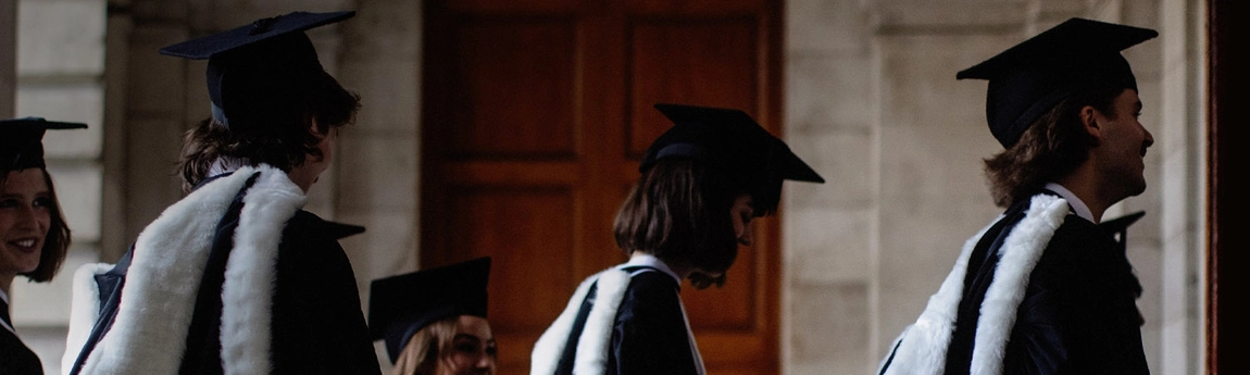 Two students in cap and gowns