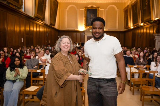 photo of provost linda doyle and spirit of s2s winner vincent. Vincent is wearing a white tshirt