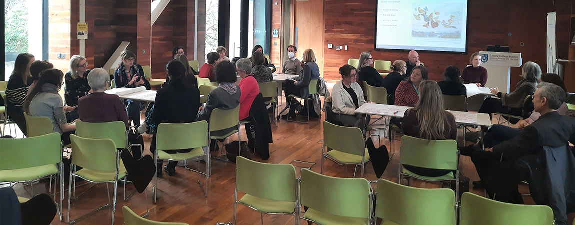 people sitting in a lecture in long room hub