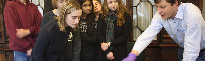 Mark faulkner showing manuscript to students
