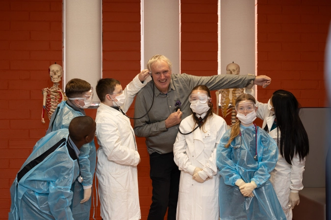 Professor Luke O'Neill with a group of Primary School students