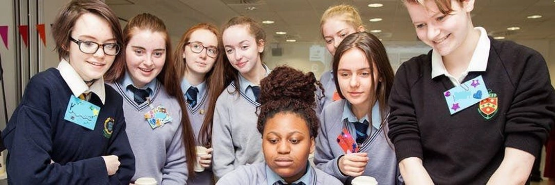 Students sitting around a computer