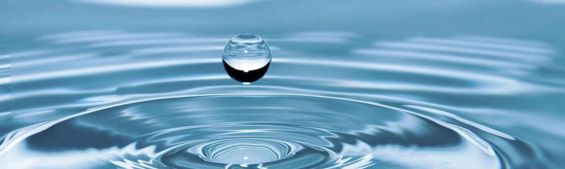 A water droplet about to hit a volume of water