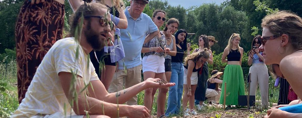 Group shown handful of seeds/crop growing in warm climate