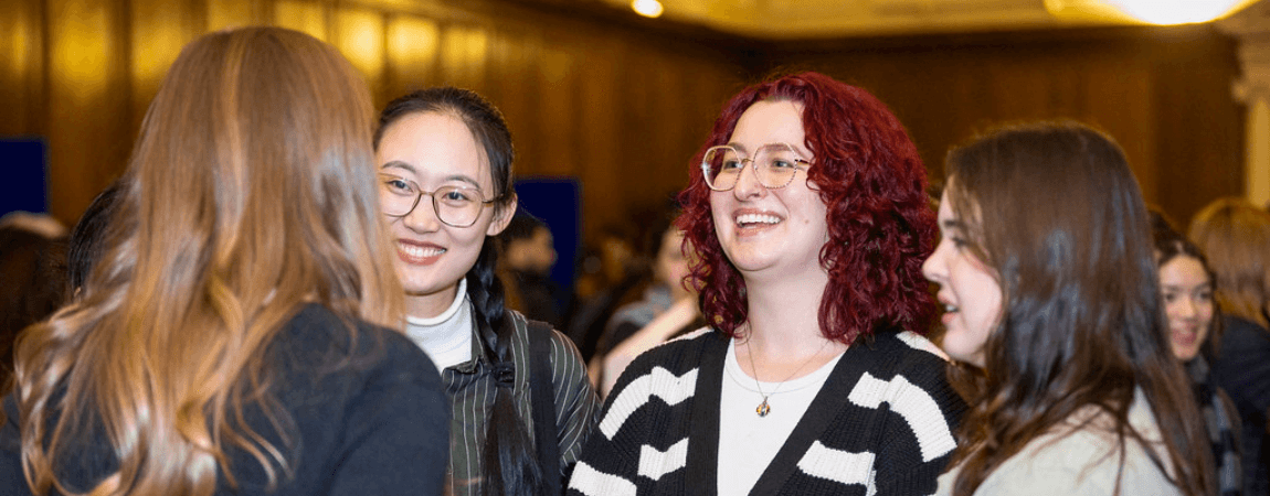 Students speaking with a mentor at a Trinity career event
