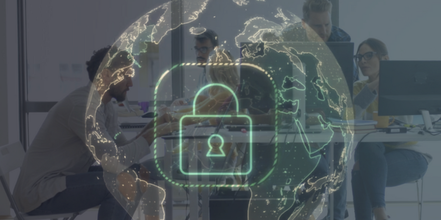 A group of people working on computers while staying cybersecure