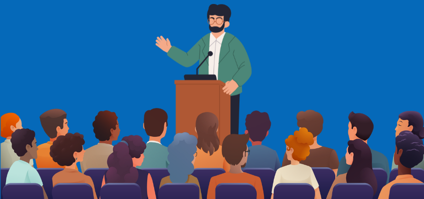 image of a lecturer standing at podium in front of students