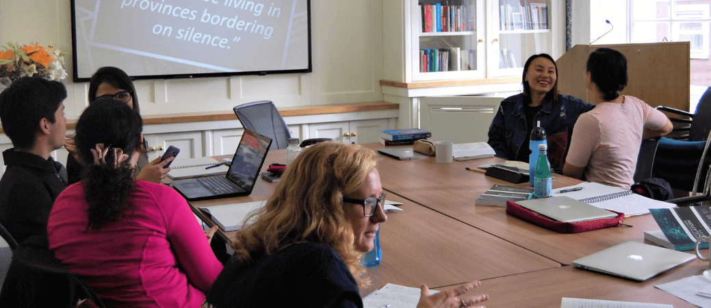 Students seated around a table during a Literary Translation class.